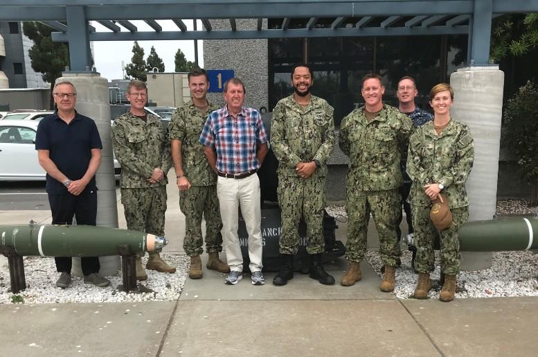 Russell Pegg and Alexander Walker with members of the USN Operations staff.